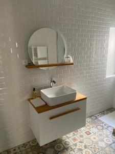 a bathroom with a sink and a mirror at SUPERBE STUDiO LE PANIER NO EXTRA FEES historic district in Marseille