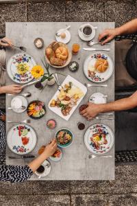 a table with plates of food on it at Hotel Winkler-Tuschnig in Weissensee