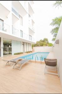 a swimming pool in the middle of a building at The Pine Court in Accra