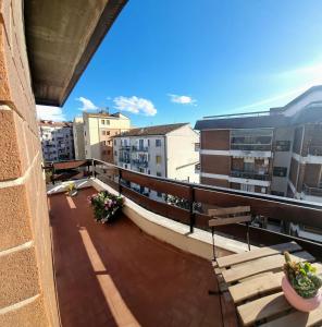 a view of a balcony with benches and buildings at Sunbath House Pisa - Free Parking - Near Pisa Center in Pisa