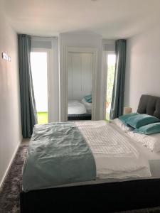 Ένα ή περισσότερα κρεβάτια σε δωμάτιο στο Apartment Gran Canet by GRENT