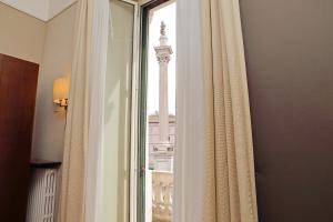 a window in a room with a view of a building at Domus Maggiore in Rome