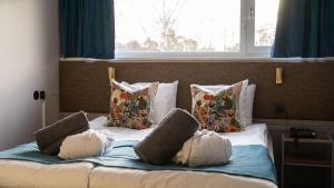 Postel nebo postele na pokoji v ubytování Sigtunahöjden Hotell & Konferens + 34 fotografií