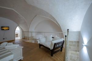 A bed or beds in a room at Casale Donna Rosa