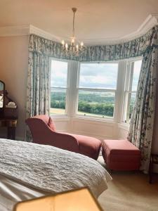a bedroom with two beds and a window at Clint Lodge in Melrose