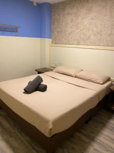 Postel nebo postele na pokoji v ubytování Suria Cameron Hotel