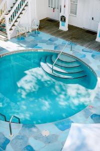 a swimming pool with stairs in a house at Deluxe King with Balcony by Brightwild- at James House with Parking! in Key West