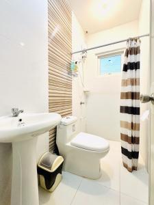 A bathroom at Feel at Home Gensan Wi-fi Netflix Carport Hot Shower BBQ Grill