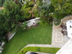 an overhead view of a garden with a lawn at In White Villa in Lagonissi
