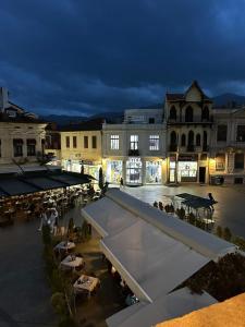 a view of a town square at night at Magnolija Apartments in Bitola