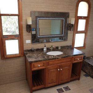 a bathroom with a sink and a mirror at Abdelli Terraces in Batroun in Batroûn