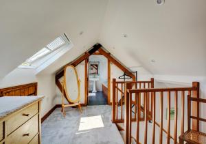 a attic room with a sink and a staircase at Dentford Heights in Beetley