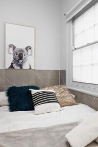 a room with a bed with a picture of a koala at Private Double Bed in Sydney CBD Near Train in Sydney