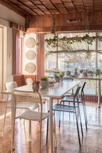 a dining room with a table and chairs at Rustic Private Room in Waterfront Beach Retreat 7 - SHAREHOUSE in Sydney