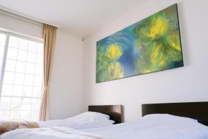 Postel nebo postele na pokoji v ubytování Hotel Kailani