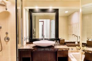 a bathroom with a sink and a large mirror at InterContinental Tokyo Bay by IHG in Tokyo