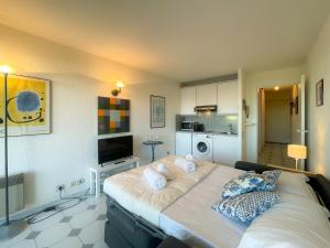 a bedroom with a large bed with pillows on it at Port Vauban Sea Front 3 Pers AC WiFi in Antibes