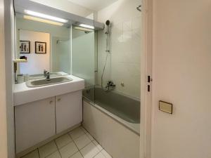 a bathroom with a sink and a shower at Port Vauban Sea Front 3 Pers AC WiFi in Antibes