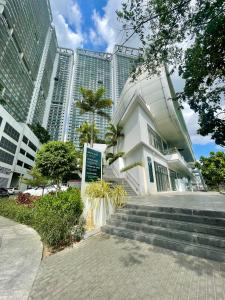 a building in a city with tall buildings at The Serene Escape Rockwell Makati City View 1BR in Manila