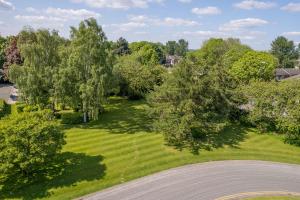 an overhead view of a yard with trees and a road at The Derby Conference Centre and Hotel in Derby