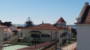 a view of a building with a tennis court at Beach House Cascais in Estoril