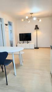a living room with a white table and a tv at 2room with 4beds near kintex daehwa station in Goyang