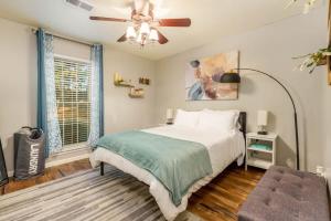 a bedroom with a bed and a ceiling fan at Gorgeous Alabama Home 4 Miles to Stadium Sleeps 8 in Tuscaloosa