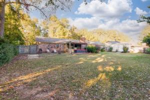 an empty yard in front of a house at Gorgeous Alabama Home 4 Miles to Stadium Sleeps 8 in Tuscaloosa