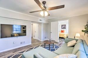 a living room with a couch and a flat screen tv at Southern Charm l 5BR l Sleeps 14 l A Location in Birmingham