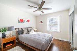 a bedroom with a bed and a ceiling fan at Southern Charm l 5BR l Sleeps 14 l A Location in Birmingham