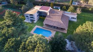 an overhead view of a house with a swimming pool at Can Estrelles Luxury Villa in Mont Barbat