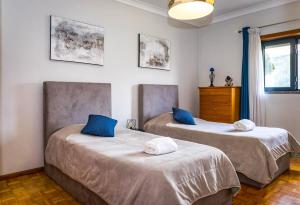 two beds sitting next to each other in a room at Fraga Douro House, Douro Valley in Resende