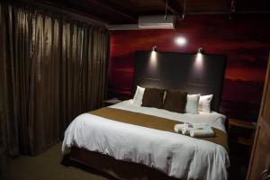 Postel nebo postele na pokoji v ubytování SNEL GUEST LODGE + 31 fotografií