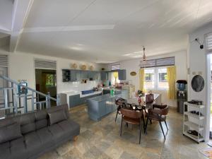 a living room with a couch and a table at Villa Nesa Puncak Cipanas in Cipanas