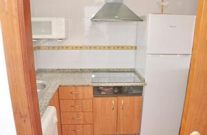 Kuchyňa alebo kuchynka v ubytovaní Apartamento vistas al parque