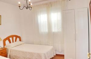 Posteľ alebo postele v izbe v ubytovaní Apartamento vistas al parque