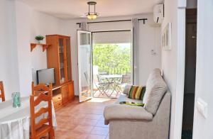 Televízia a/alebo spoločenská miestnosť v ubytovaní Apartamento vistas al parque