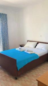Posteľ alebo postele v izbe v ubytovaní Red Sun Apartments