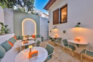 a patio with tables and chairs in a restaurant at Old Town Hotel Kalkan in Kalkan