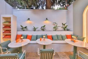 a restaurant with two tables and a couch at Old Town Hotel Kalkan in Kalkan