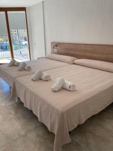 Postel nebo postele na pokoji v ubytování Hotel Blason Junior
