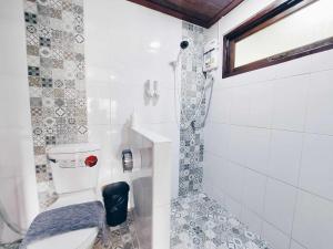a bathroom with a toilet and a shower at Hello Sunshine in Phra Nakhon Si Ayutthaya +138 photos