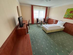 Telewizja i/lub zestaw kina domowego w obiekcie Hotel Breitenlee
