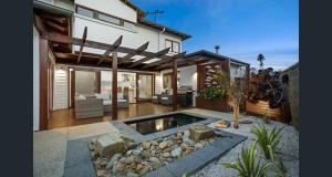 a house with a swimming pool in the yard at Beach and Golf Haven With Spa Luxury Living in Connewarre