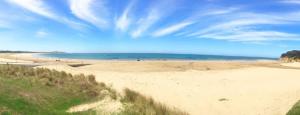 a view of a beach with the ocean in the background at Whitewash Beachfront Apartment on The Esplanade in Torquay