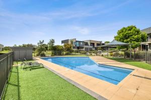 an image of a swimming pool in a yard at Sands Coastal Villa Close to Pool, Beach and Golf in Torquay