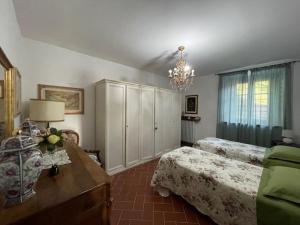A bed or beds in a room at Appartamento in villa - Maria Grazia