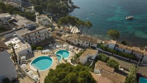 an aerial view of a resort with two swimming pools at Inmood Aucanada 4 Sup in Port d'Alcudia