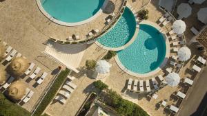 an overhead view of two pools in a resort at Inmood Aucanada 4 Sup in Port d'Alcudia