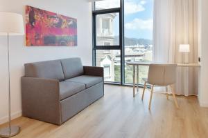 a living room with a couch and a table at INNSiDE by Meliá Tenerife Santa Cruz in Santa Cruz de Tenerife